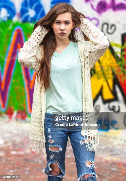 payton, urban fashion & the painted wall 1 - lamont stock pictures, royalty-free photos & images
