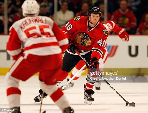 Colin Fraser of the Chicago Blackhawks brings the puck up the ice against Niklas Kronwall of the Detroit Red Wings at the United Center on April 11,...