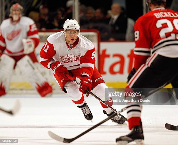 Valtteri Filppula of the Detroit Red Wings skates up the ice against Bryan Bickell of the Chicago Blackhawks at the United Center on April 11, 2010...