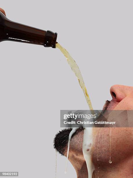 beer shower - beer bottle mouth stock-fotos und bilder