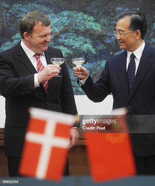 Danish Prime Minister Lars Lokke Rasmussen toasts with Chinese premier Wen Jiabao during the signing ceremony at the Great Hall of the People on...