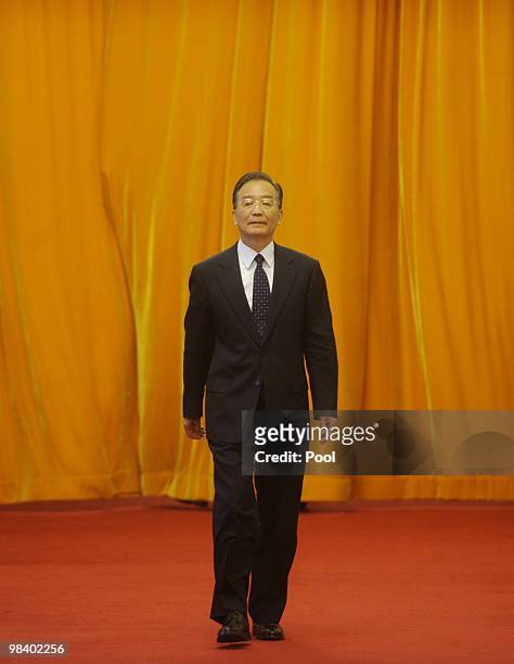 Chinese premier Wen Jiabao walks out to wlcome Danish Prime Minister Lars Lokke Rasmussen at the Great Hall of the People on April 12, 2010 in...