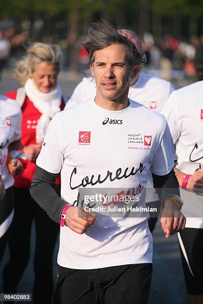 Paul Belmondo runs for the 'Mecenat Chirurgie Cardiaque' association during the Paris marathon on April 11, 2010 in Paris, France.