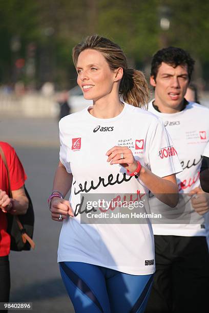 Sylvie Tellier runs for the 'Mecenat Chirurgie Cardiaque' association during the Paris marathon on April 11, 2010 in Paris, France.