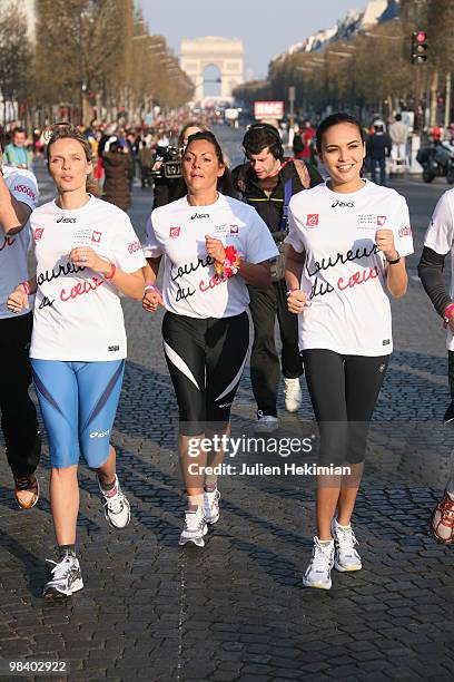 Sylvie Tellier, Hermine de Clermont-Tonnerre and Valerie Begue run for the 'Mecenat Chirurgie Cardiaque' association during the Paris marathon on...