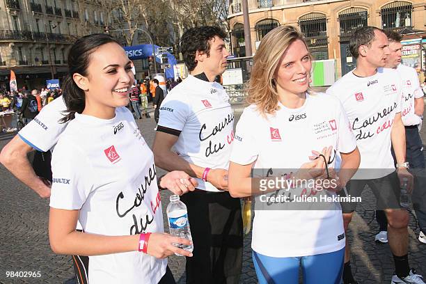 Sylvie Tellier and Valerie Begue are pictured after their run for the 'Mecenat Chirurgie Cardiaque' association during the Paris marathon on April...