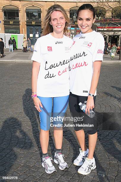 Sylvie Tellier and Valerie Begue pose together after their run for the 'Mecenat Chirurgie Cardiaque' association during the Paris marathon on April...