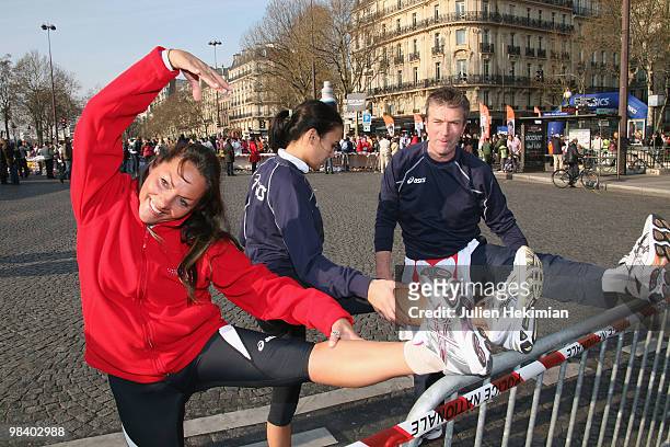 Hermine de Clermont-Tonnerre, Valerie Begue and Philippe Caroit stretch after their run for the 'Mecenat Chirurgie Cardiaque' association during the...
