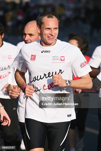 Louis Laforge runs for the 'Mecenat Chirurgie Cardiaque' association during the Paris marathon on April 11, 2010 in Paris, France.
