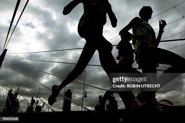 Participants of the Marathon Rotterdam cross the Erasmus bridge in Rotterdam during the 30th edition of the event on April 11th, 2010. AFP...