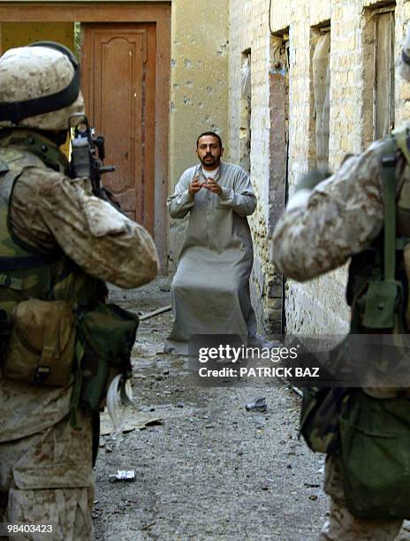 An Iraqi man gestures to US marines from the 3/5 Lima company conducting a house-to-house search in the Jolan district of the restive city of...