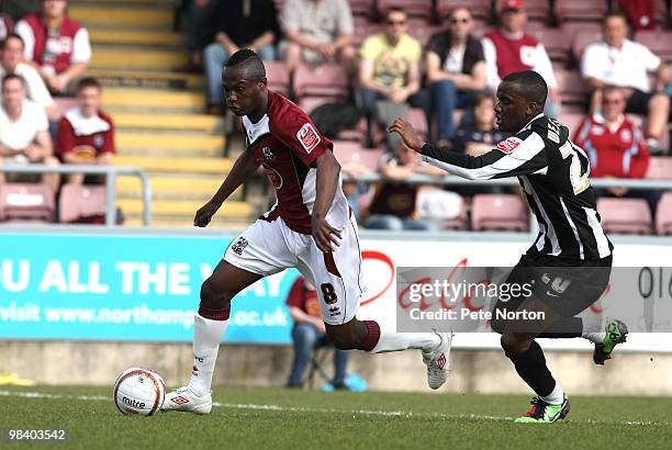 Abdul Osman of Northampton Town moves past Craig Westcarr of Notts County during the Coca Cola League Two Match between Northampton Town and Notts...