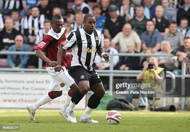Delroy Facey of Notts County looks to control the ball watched by Abdul Osman of Northampton Town during the Coca Cola League Two Match between...