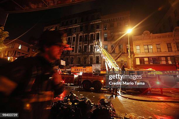 Firefighters respond to a seven-alarm blaze on Grand Street in Chinatown on April 12, 2010 in New York City. Over 250 firefighters have responded to...