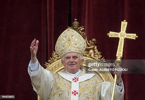 Pope Benedict XVI delivers the traditional "Urbi et Orbi" Easter message from the central loggia of St Peter's Basilica on April 4, 2010 at the...