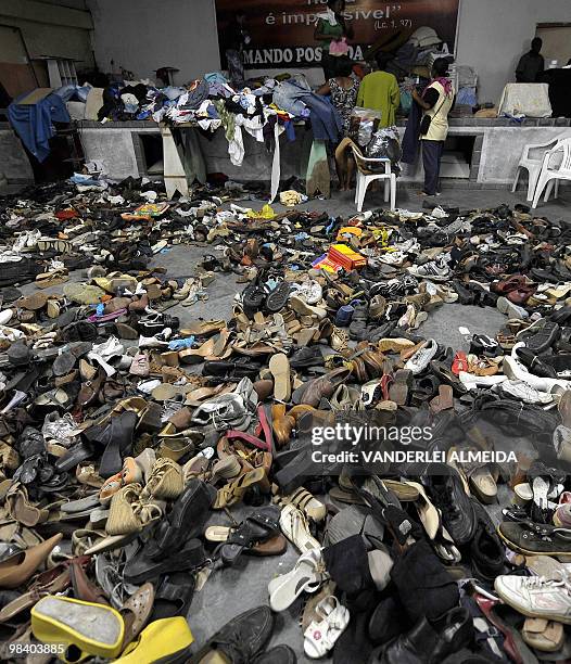 Volunteers organize clothes donated from all over Brazil to be given to victims a landslide in Vicoso Jardim Bumba shantytown in Niteroi, 25 km from...