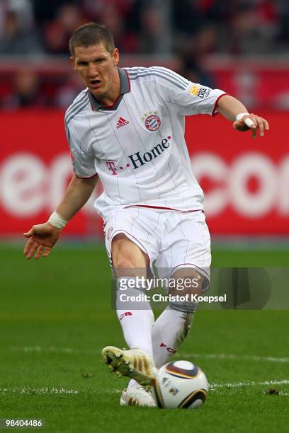 Bastian Schweinsteiger of Bayern runs with the ball during the Bundesliga match between Bayer Leverkusen and FC Bayern Muenchen at the BayArena on...