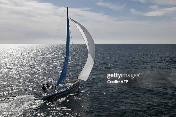 French yachtsmen Christophe Rateau and Sylvain Pontu sail onboard their monohull "iSanté", on April 11, 2010 off the coast of Concarneau, western...