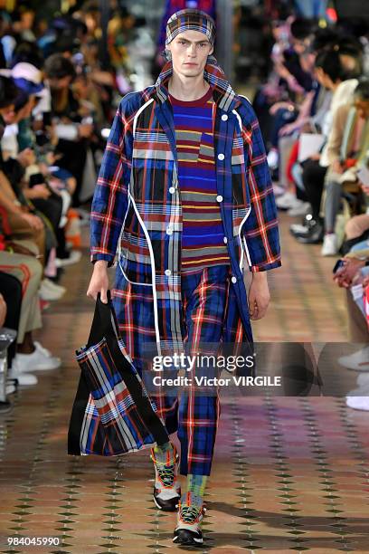 Model walks the runway during the White Mountaineering Menswear Spring/Summer 2019 fashion show as part of Paris Fashion Week on June 23, 2018 in...