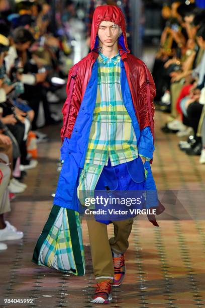 Model walks the runway during the White Mountaineering Menswear Spring/Summer 2019 fashion show as part of Paris Fashion Week on June 23, 2018 in...