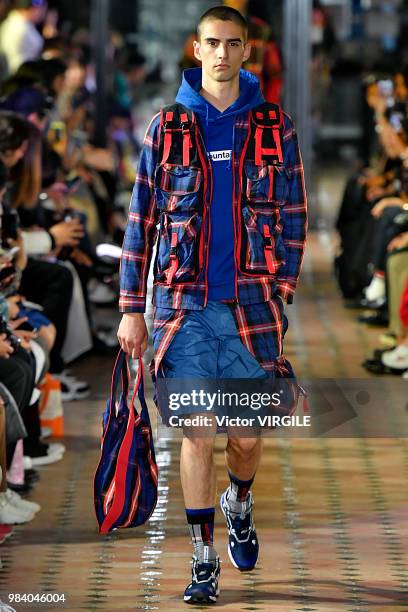 Model walks the runway during the White Mountaineering Menswear Spring/Summer 2019 fashion show as part of Paris Fashion Week on June 23, 2018 in...