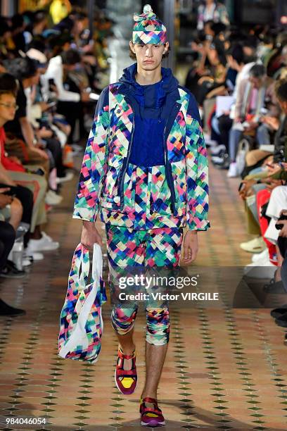 Model walks the runway during the White Mountaineering Menswear Spring/Summer 2019 fashion show as part of Paris Fashion Week on June 23, 2018 in...