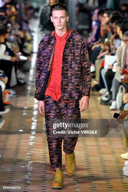 Model walks the runway during the White Mountaineering Menswear Spring/Summer 2019 fashion show as part of Paris Fashion Week on June 23, 2018 in...