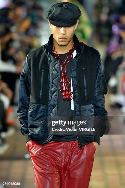 Model walks the runway during the White Mountaineering Menswear Spring/Summer 2019 fashion show as part of Paris Fashion Week on June 23, 2018 in...