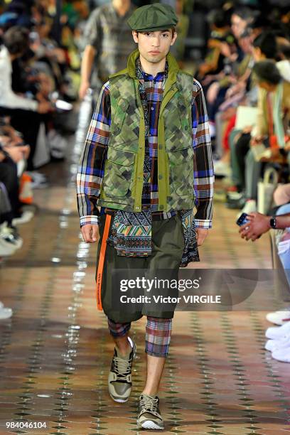 Model walks the runway during the White Mountaineering Menswear Spring/Summer 2019 fashion show as part of Paris Fashion Week on June 23, 2018 in...