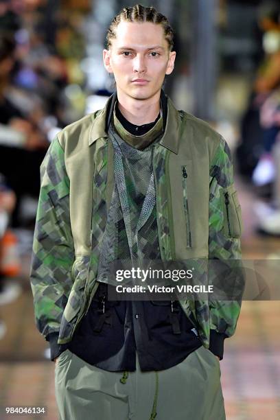 Model walks the runway during the White Mountaineering Menswear Spring/Summer 2019 fashion show as part of Paris Fashion Week on June 23, 2018 in...