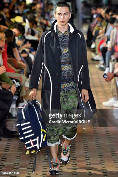Model walks the runway during the White Mountaineering Menswear Spring/Summer 2019 fashion show as part of Paris Fashion Week on June 23, 2018 in...