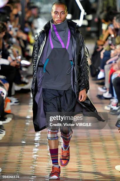 Model walks the runway during the White Mountaineering Menswear Spring/Summer 2019 fashion show as part of Paris Fashion Week on June 23, 2018 in...