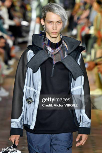 Model walks the runway during the White Mountaineering Menswear Spring/Summer 2019 fashion show as part of Paris Fashion Week on June 23, 2018 in...