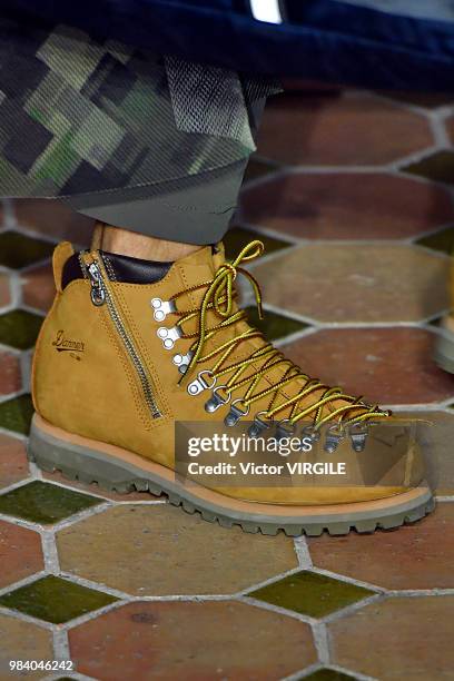 Model walks the runway during the White Mountaineering Menswear Spring/Summer 2019 fashion show as part of Paris Fashion Week on June 23, 2018 in...