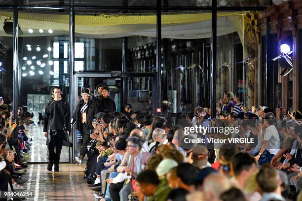 Model walks the runway during the White Mountaineering Menswear Spring/Summer 2019 fashion show as part of Paris Fashion Week on June 23, 2018 in...