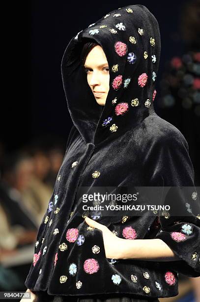 Model displays a hooded mink jacket during the 2010/2011 Royal Chie fur collection, designed by Chie Imai at a Tokyo hotel on April 12, 2010. AFP...