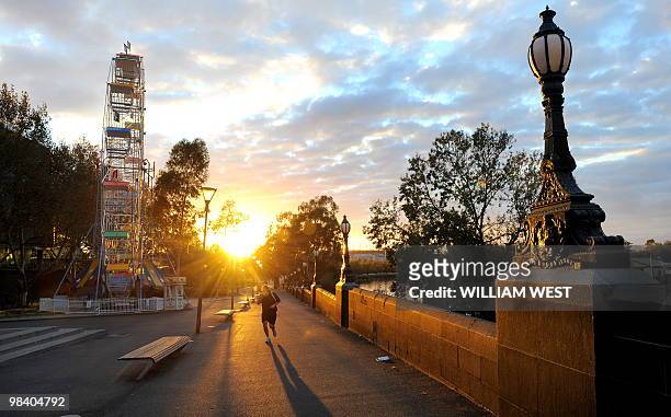 Photo taken April 2, 2010 shows a jogger in Birrarung Marr, an inner-city park between the central business district in Melbourne and the Yarra...