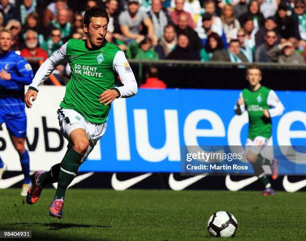 Mesut Oezil of Bremen and runs with the ball during the Bundesliga match between Werder Bremen and SC Freiburg at the Weser Stadium on April 10, 2010...