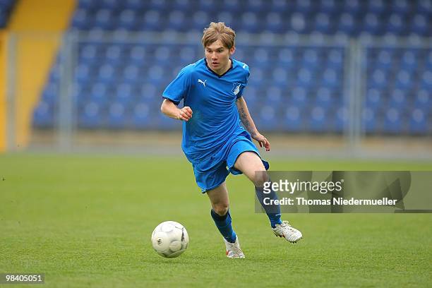 Christian Lesch of Hoffenheim runs the ball during the DFB Juniors Cup half final between TSG 1899 Hoffenheim and FC Energie Cottbus at the...