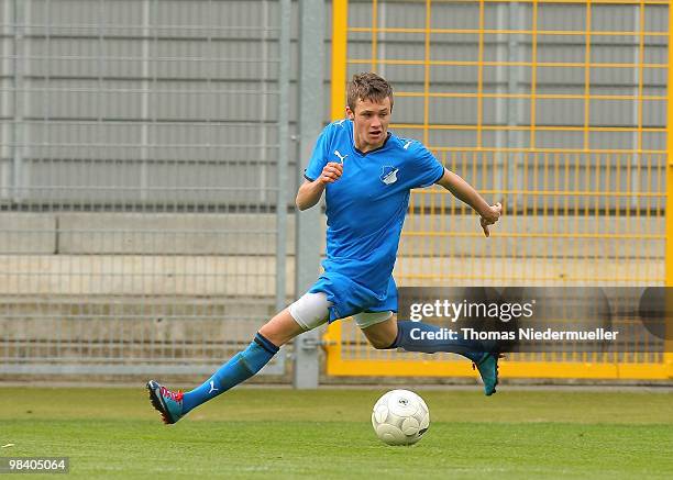 Marco Schaefer of Hoffenheim runs the ball during the DFB Juniors Cup half final between TSG 1899 Hoffenheim and FC Energie Cottbus at the...