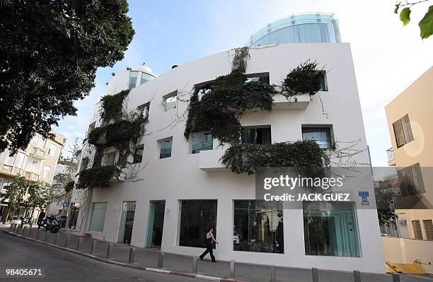 Pedestrian walks past a Bauhaus-style building in Tel Aviv, on February 22, 2010. Tel Aviv, named the White City for its collection of over 4,000...