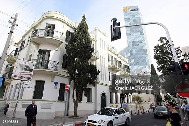 Pedestrian walks past a Bauhaus-style building in Tel Aviv, on February 22, 2010. Tel Aviv, named the White City for its collection of over 4,000...