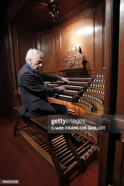 French composer, organist, pianist Jean Guillou plays the Saint-Eustache church's pipe organ, on March 24, 2010 in Paris. Since 1963 Guillou is the...