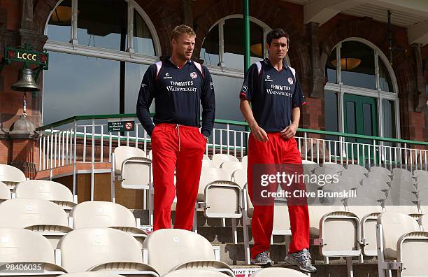 Andrew Flintoff and Kyle Hogg of Lancashire walk down the pavillion steps for the LCCC annual team photo call at Old Trafford county cricket ground...