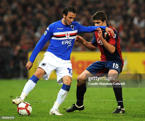 Giampaolo Pazzini of UC Sampdoria battles for the ball against Socratis Papastathopoulos of Genoa CFC during the Serie A match between UC Sampdoria...