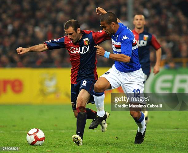 Fernando Tissone of UC Sampdoria battles for the ball against Rodrigo Palacio and Giandomenico Mesto of Genoa CFC during the Serie A match between UC...