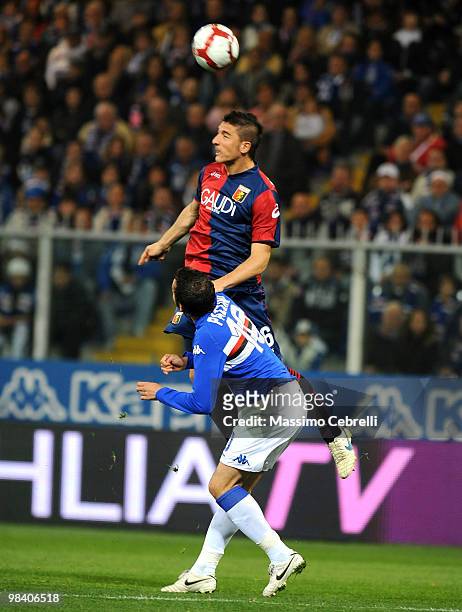 Salvatore Bocchetti of Genoa CFC goes up for the ball against Giampaolo Pazzini of UC Sampdoria during the Serie A match between UC Sampdoria and...