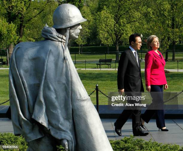 Korean President Lee Myung-bak , accompanied by U.S. Secretary of State Hillary Rodham Clinton, visits the Korean War Memorial for a wreath laying to...