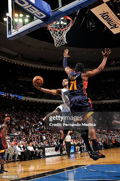 Jameer Nelson of the Orlando Magic takes the ball to the basket against Ronny Turiaf of the Golden State Warriors during the game on March 3, 2010 at...