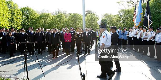 Korean President Lee Myung-bak, accompanied by U.S. Secretary of State Hillary Rodham Clinton, participates in a wreath laying during his visit to...